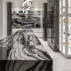 contemporary black and white kitchen with waterfall marble topped island and custom glass display cabinetry, interior design by Kim Gwozdz, Arizona